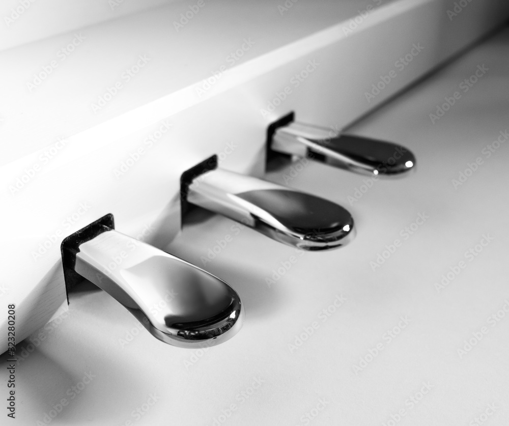 three piano pedals in silver three piano pedals in silver