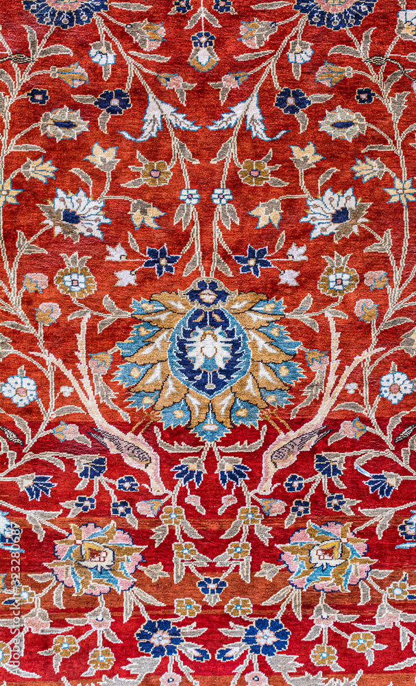 Persian carpet details. Floral motifs of the clasical Persian carpet showing floral patterns as a background