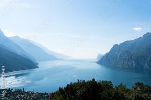 A view from above at the foggy lake garda in italy