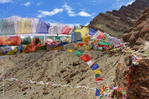 Colorful Buddhist Tibetan prayer flags high in the Himalayas - Ladakh, India