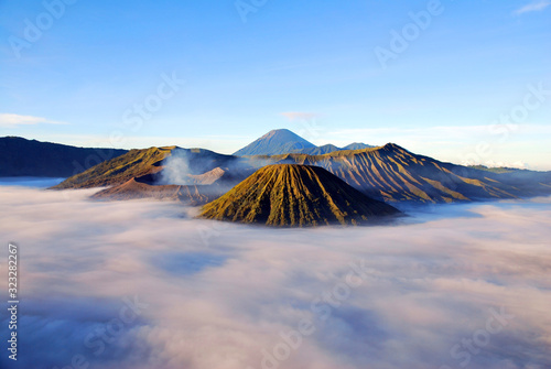 Bromo Mountain and fog around bromo mountain with sunrise from seruni viewpoint is an active volcano and part of the Tengger massif  in East Java  Indonesia. Indonesian call Gunung Bromo. Blue nature