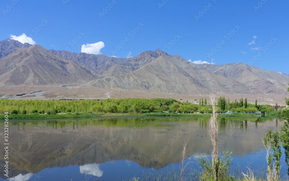 Lakes of Indus river with bare mountains behind next to Leh the joint capital and largest town of Ladakh - India 2019 Lakes of Indus river with bare mountains behind next to Leh the joint capital and largest town of Ladakh - India 2019
