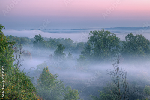 Foggy summer landscape at dawn with beautiful sky Kalamazoo River Valley, Michigan, USA