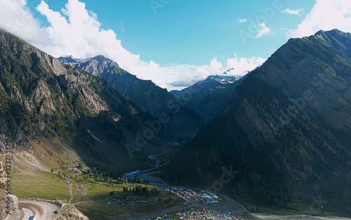 A view of base camp in the valley leading towards the holy cave shrine of Amarnath yatra Hindu religious rituals during July to August, Kashmir Himalayas, India.