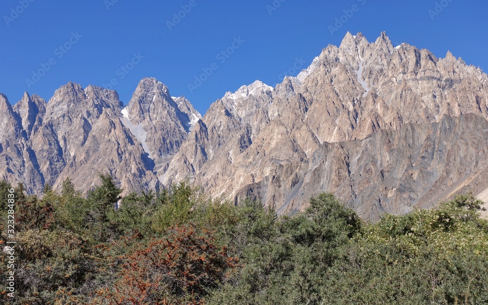 Tupopdan peaks near Passu village, also know as Passu Cones, or Passu Cathedral - upper Hunza, Northern Areas of Pakistan. 2019 Tupopdan peaks near Passu village, also know as Passu Cones, or Passu Cathedral - upper Hunza, Northern Areas of Pakistan. 2019