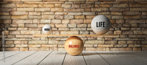 Fotografia spheres forming scale with the words WORK, LIFE and BALANCE on wooden floor in f