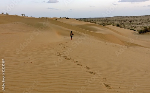 Man leaves foorprints in the dunes of a Indian desert