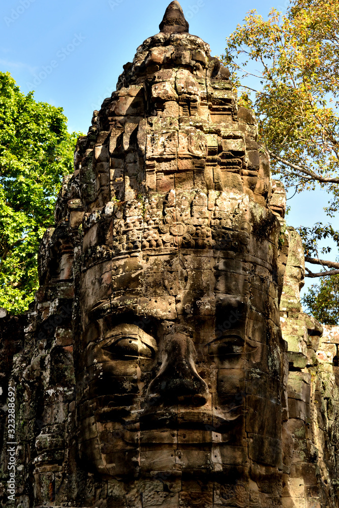 View of one face of the magnificent entrance to the complex of Angkor Thom View of one face of the magnificent entrance to the complex of Angkor Thom