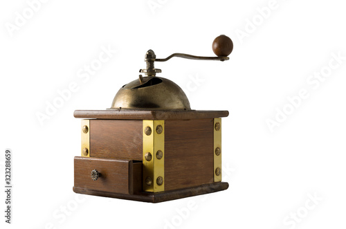 Vintage manual coffee grinder made of wood and bronze.