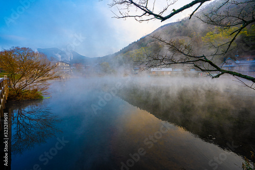 reflection in foggy water, kinrinko, oita, japan photo