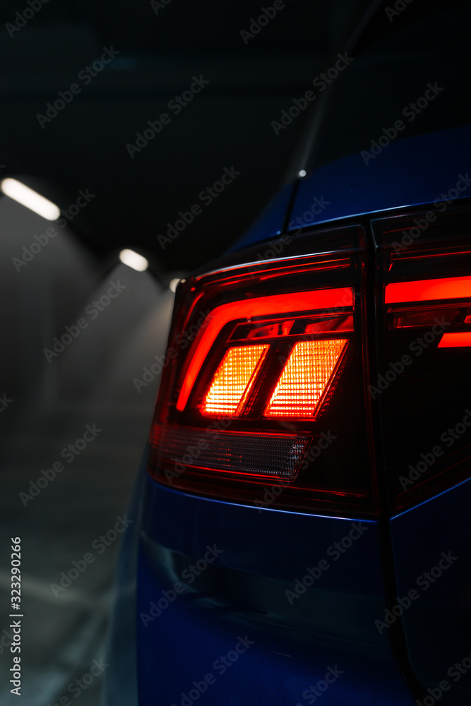 Led taillight of modern crossover at underground parking