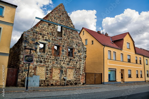 niemegk, deutschland - häuserzeile mit der ruine vom alten kloster photo