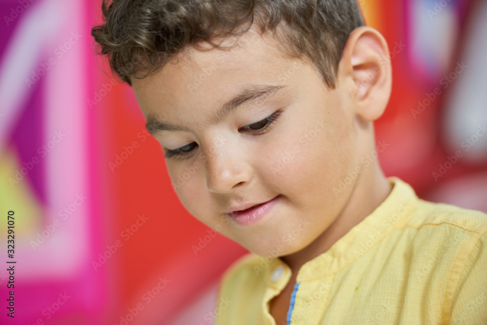 Close up portrait of handsome little boy. Cute pensive child. Kids emotion concept. Close up portrait of handsome little boy. Cute pensive child. Kids emotion concept.