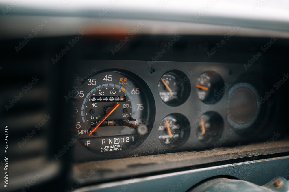 Old car dashboard speedometer close up