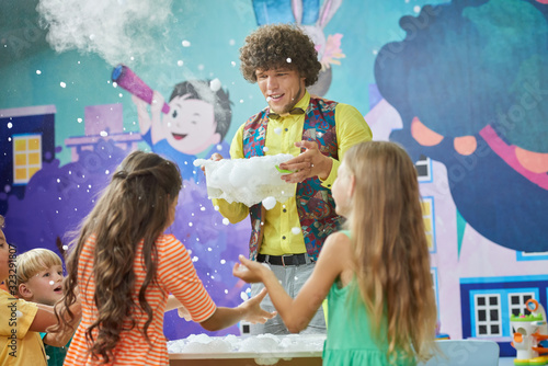 Animator showing chemistry experiments for kids. Dry ice boo bubbles experiment. City of professions for children.