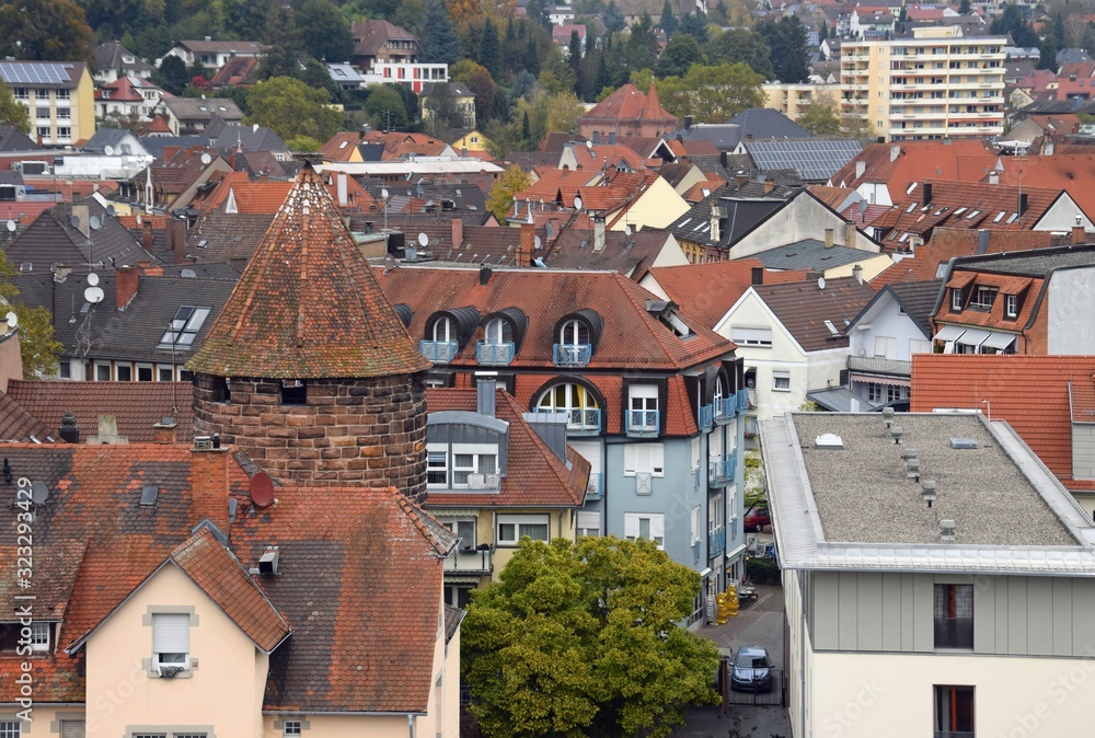 high angle view across the roofs of downtown buildings with partial view of the Storchenturm landmark Lahr Baden Germany high angle view across the roofs of downtown buildings with partial view of the Storchenturm landmark Lahr Baden Germany