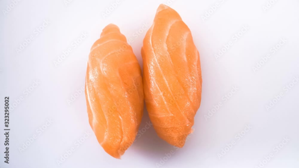 Top view of spinning two salmon sushi.