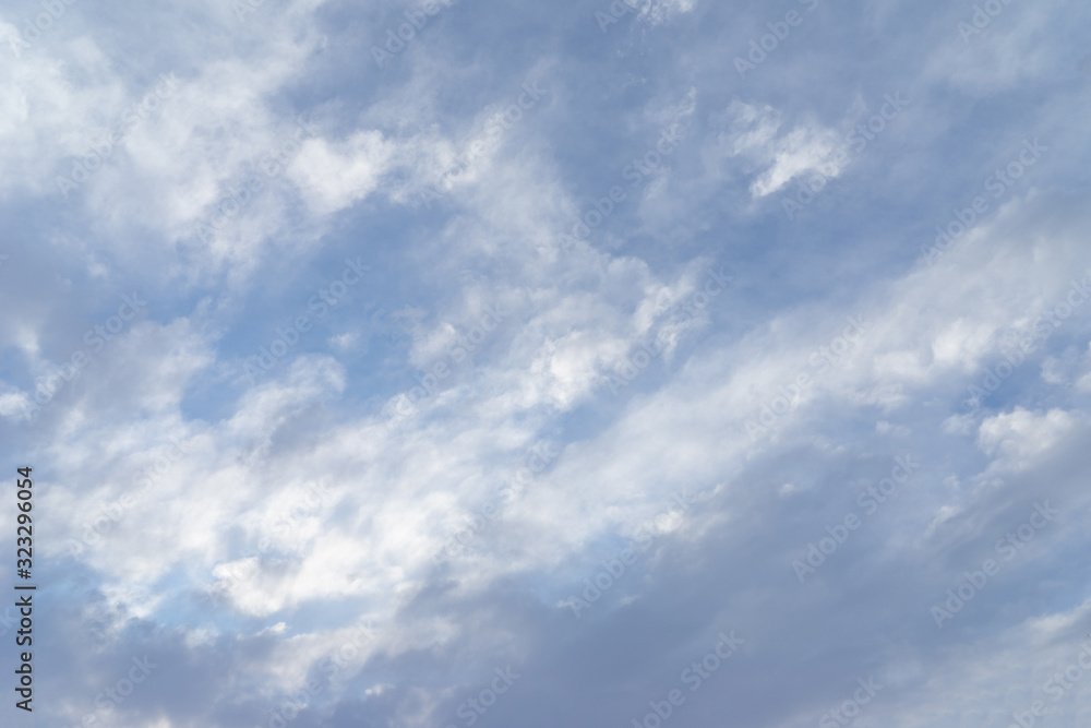 Blue sky covered with gray clouds