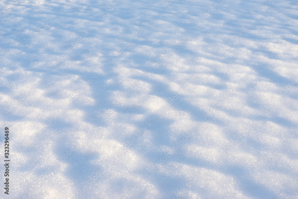 Melted snow with an interesting texture with shadows from bumps Melted snow with an interesting texture with shadows from bumps