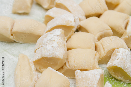 Pieces of dough before cooking homemade dumplings at home