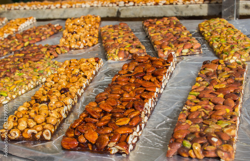 Walnut, almond and Pistachio nut bars on the table, Mediterranean sweets.