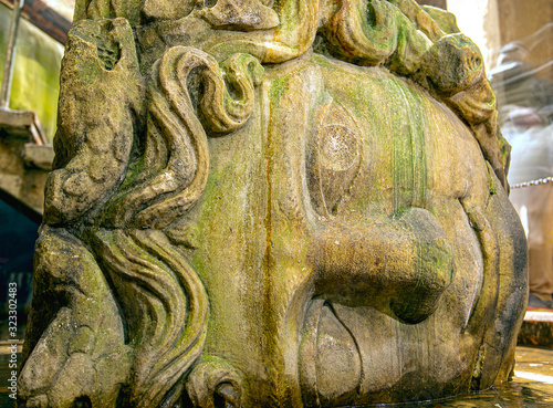 Close-up Head of Gorgon Medusa in Basilica Cistern or Yerebatan Sarnici in Istanbul, Turkey