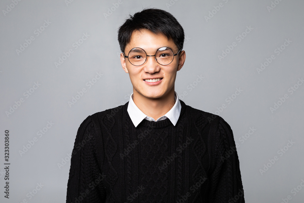 Obraz premium Chinese handsome man smiling and laughing isolated on white background