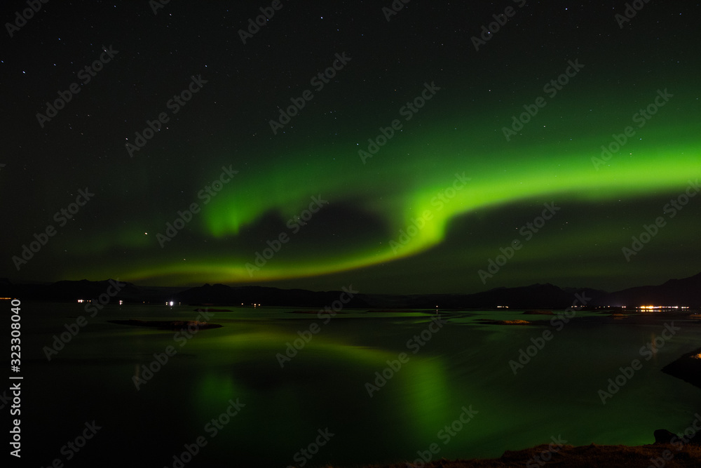 Aurora borealis above Hornafjordur fjord in Iceland