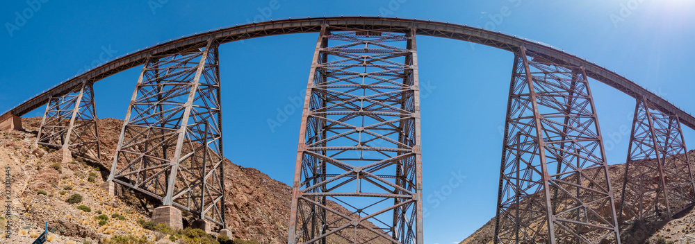 Rusty railroad bridge.