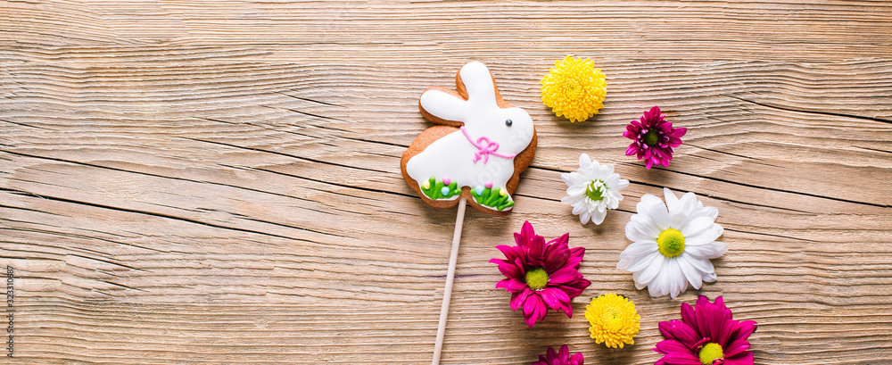 Easter cookies on wooden background, gingerbread in the shape of a rabbit Easter cookies on wooden background, gingerbread in the shape of a rabbit