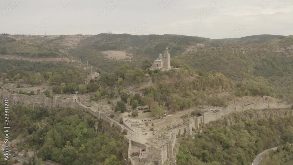 Misty sunrise over the famous Tsarevets Fortress in Veliko Tarnovo, Bulgaria. Aerial drone footage Misty sunrise over the famous Tsarevets Fortress in Veliko Tarnovo, Bulgaria. Aerial drone footage