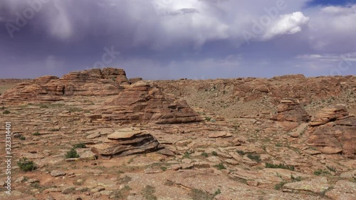 Rock formations and stacked stones on granite hilltops, Baga Gazriin Chuluu, Gobi desert, Mongolia, panorama 4k photo