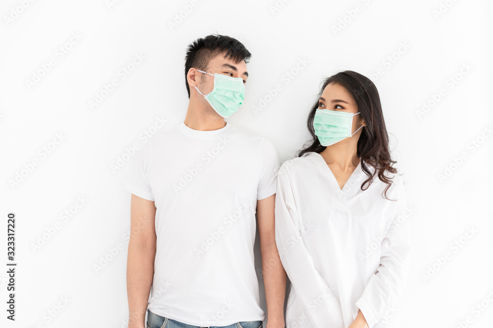 couple asian people wear surgical mask on white background, they want to pollution protection and virus protection, healthcare and infection control couple asian people wear surgical mask on white background, they want to pollution protection and virus protection, healthcare and infection control