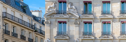 Paris, typical facades and windows, beautiful buildings in Montmartre, with horses carved on the façade