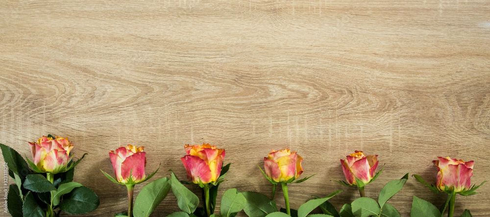 Fresh bouquet of rosses on the wooden background with some text space Fresh bouquet of rosses on the wooden background with some text space
