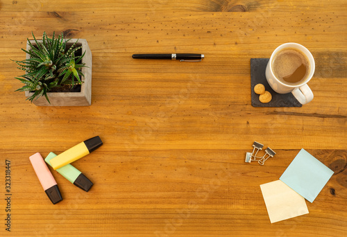 Table Top desk view with pencil a plant coffee, workspace