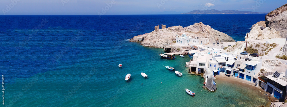 Aerial drone ultra wide photo of famous fishing seaside village of Firopotamos with traditional Cycladic character, Milos island, Cyclades, Greece
