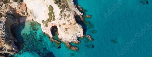 Aerial drone ultra wide photo of famous volcanic rocky beach of Tsigrado in island of Milos, Cyclades, Greece