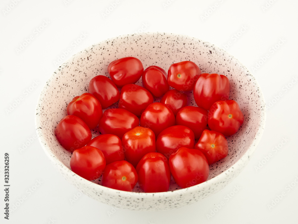 Ripe, red cherry tomatoes of the confetto variety Ripe, red cherry tomatoes of the confetto variety