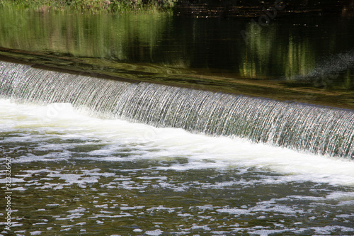 Water Flowing Over a Dam