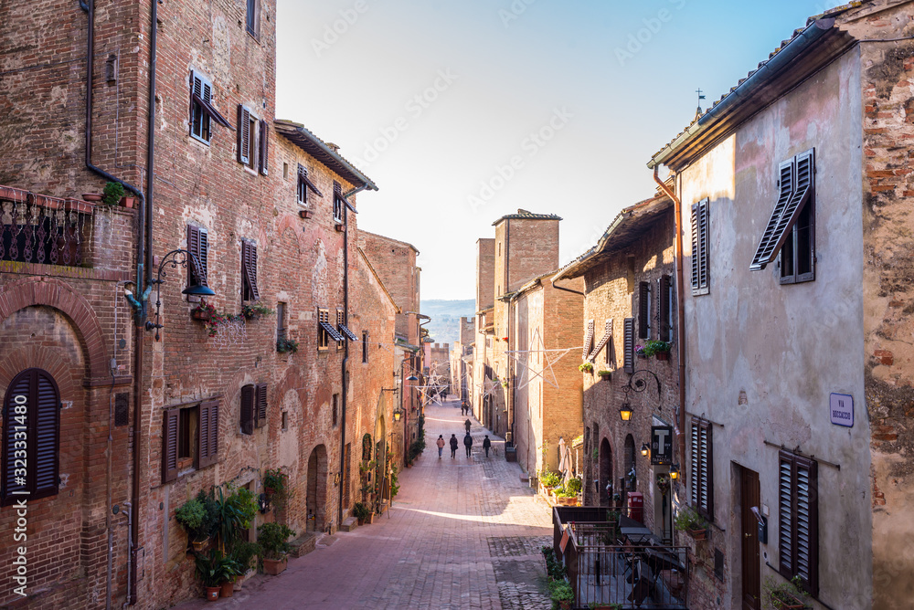 Certaldo, Tuscany, Italy - December 2019: View of the main cobbled street in the medieval town of Certaldo, Tuscany, Italy