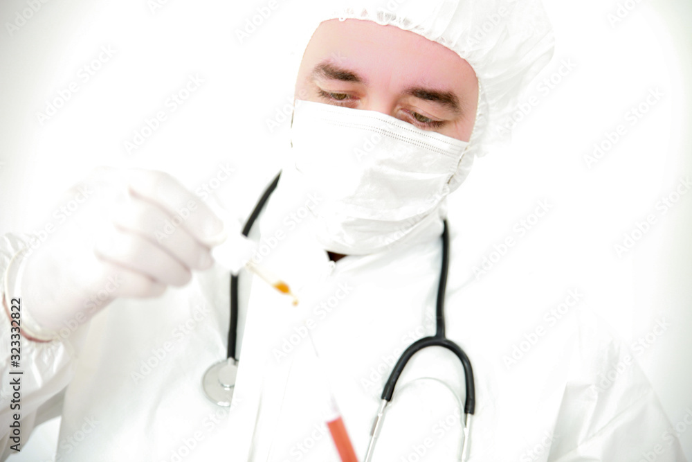 A young male doctor holds blood samples ready for analysis in the lab.-Image