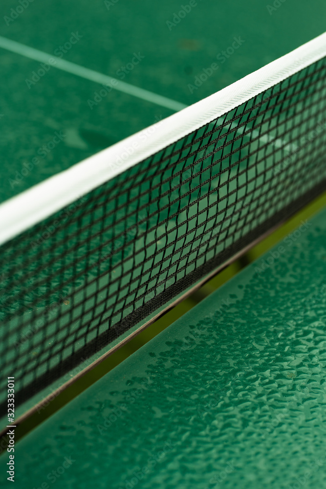 Table Tennis or ping pong rackets and balls on table. Sport concept.Texture of green wooden table,equipment for table tennis sport Table Tennis or ping pong rackets and balls on table. Sport concept.Texture of green wooden table,equipment for table tennis sport