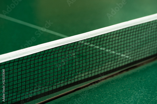 Table Tennis or ping pong rackets and balls on table. Sport concept.Texture of green wooden table,equipment for table tennis sport