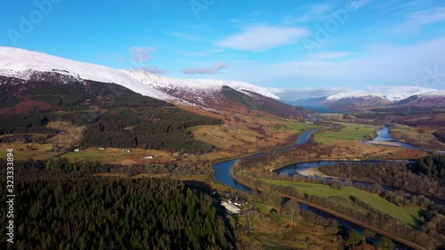 aerial drone footage of the caledonian canal and fort william in the argyll region of the highlands of scotland on a clear blue winter day photo