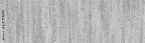 Light concrete wall with gray shade background.Cement grunge texture.Long wall background.
