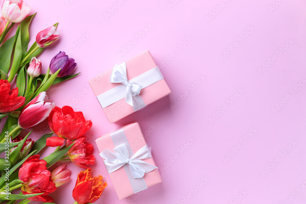 Spring, Women, Mother's day, DIY, holidays preparation and creativity layout. Handmade paper gift boxes with floral decorations on pink