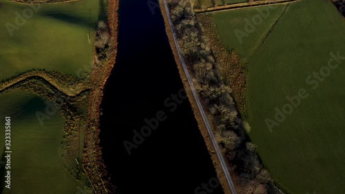 aerial drone footage of the caledonian canal and fort william in the argyll region of the highlands of scotland on a clear blue winter day photo
