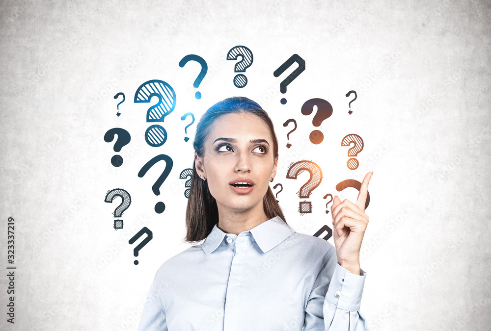 Woman pointing at question marks, good idea Stock Photo Adobe Stock