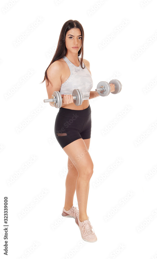 Pretty woman working out whit dumbbells